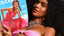 Bikini Flavors model wearing reversible bandeau top in Pink Sapphire
