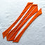 Flat Lay photo of Bikini Flavors bow ties in Orange