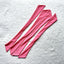 Flat Lay photo of Bikini Flavors bow ties in Pinky K
