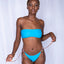 Front view of Bikini Flavors model wearing reversible bandeau top and american bottoms in Blue Sangria