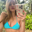 Bikini Flavors model wearing reversible Cross Back Bikini Top in Berry Breeze