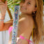 Bikini Flavors model holding spaghetti string gift package