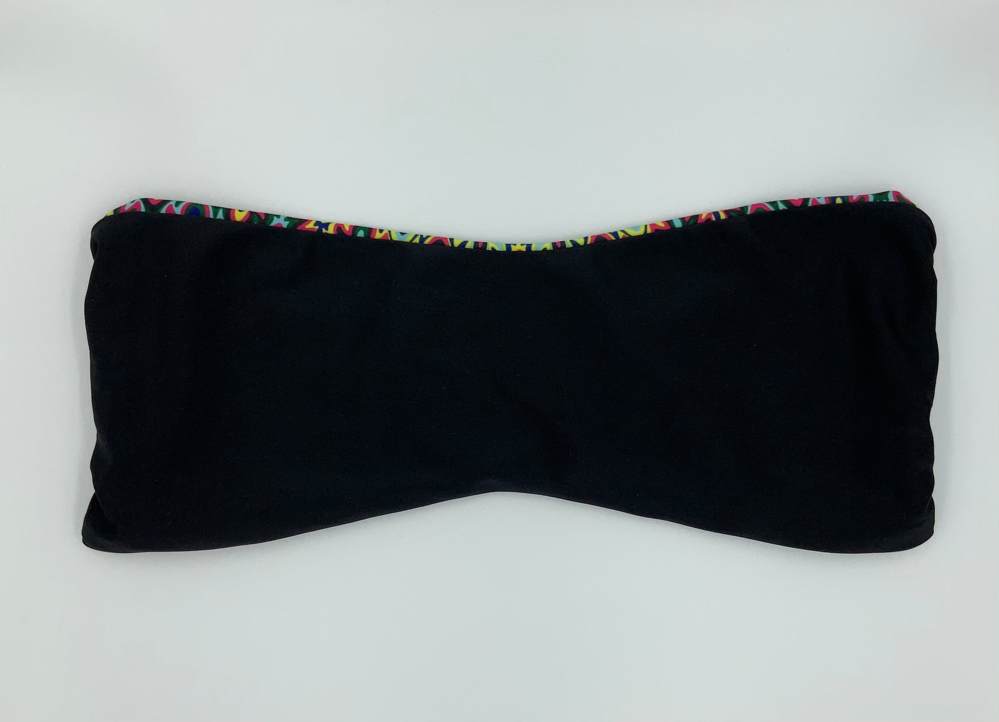 Black Sapphire Reversible Bandeau Bikini Top by Bikini Flavors. Black reverses to colorful print, Mix and match with Berry Breeze, Plum Pretty or Strawberry Sunrise. American Made.