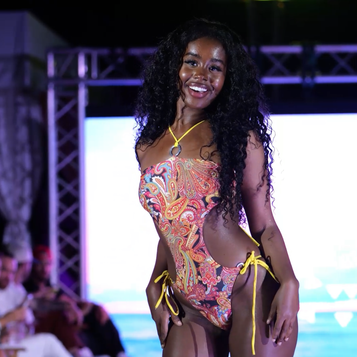 Model wearing Bikini Flavors reversible monokini on the runway at Miami Swim Week. 