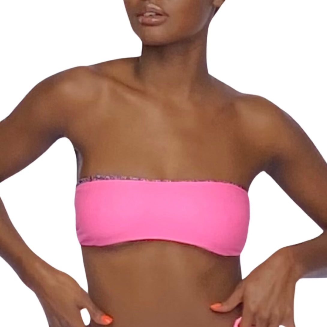 Bikini model wearing reversible Pink Sapphire bandeau bikini top.  Pink reverses to print.  American made. 