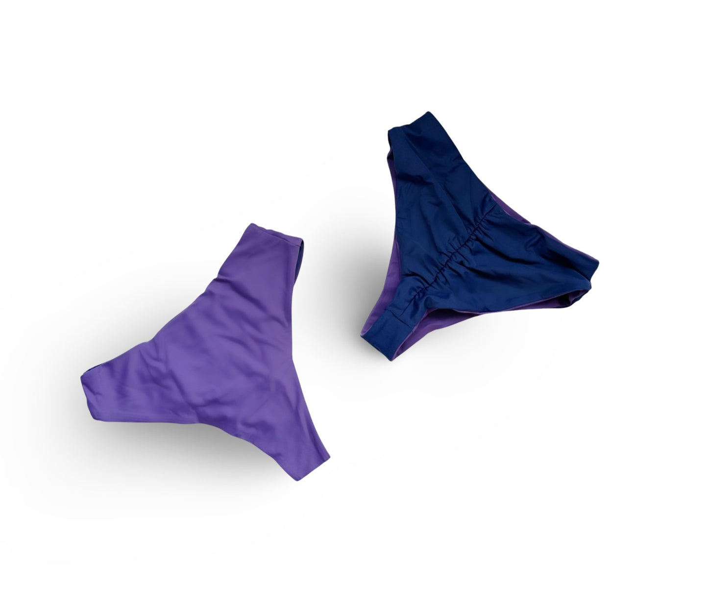 Reversible High waist cheeky bikini bottoms by Bikini Flavors shown in Plum Pretty.  Purple reverses to navy.  American Made. 
