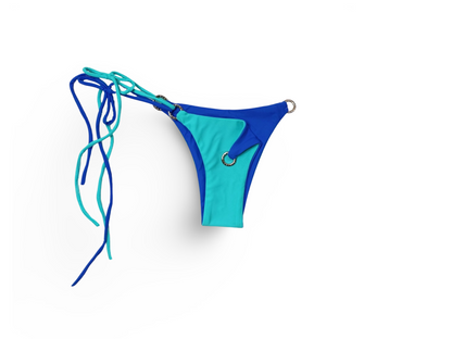 Reversible Brazilian bikini bottom in Berry Breeze by Bikini Flavors.  Aqua reverses to periwinkle blue. Interchangeable ties, signature hardware.  American Made. 