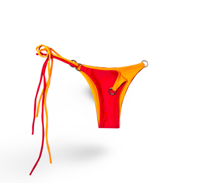 Reversible Brazilian bikini bottom in Cherry Crush by Bikini Flavors.  Red reverses to orange. Interchangeable ties, signature hardware.  American Made. 