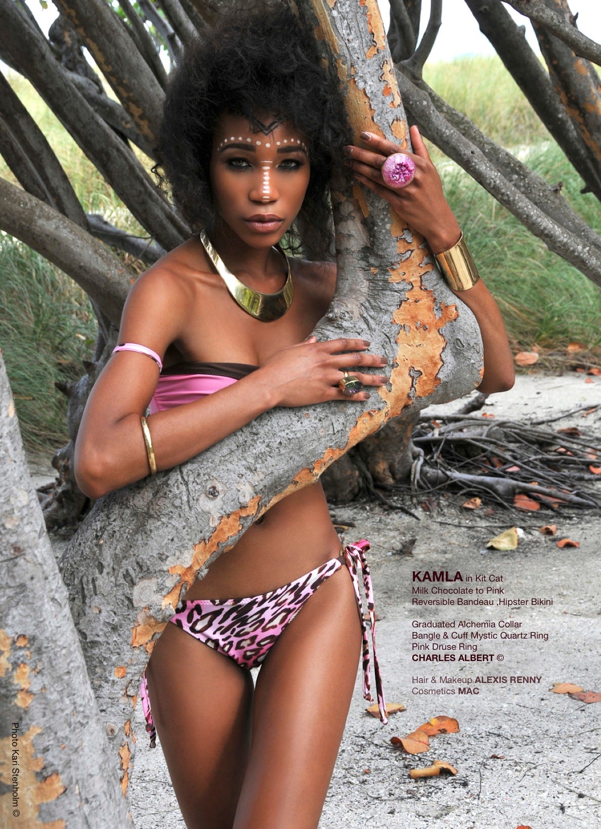 Bikini model in mangrove roots wearing a reversible pink and brown bandeau bikini top, and a tie-side pink and brown leopard bottom, both by Bikini Flavors