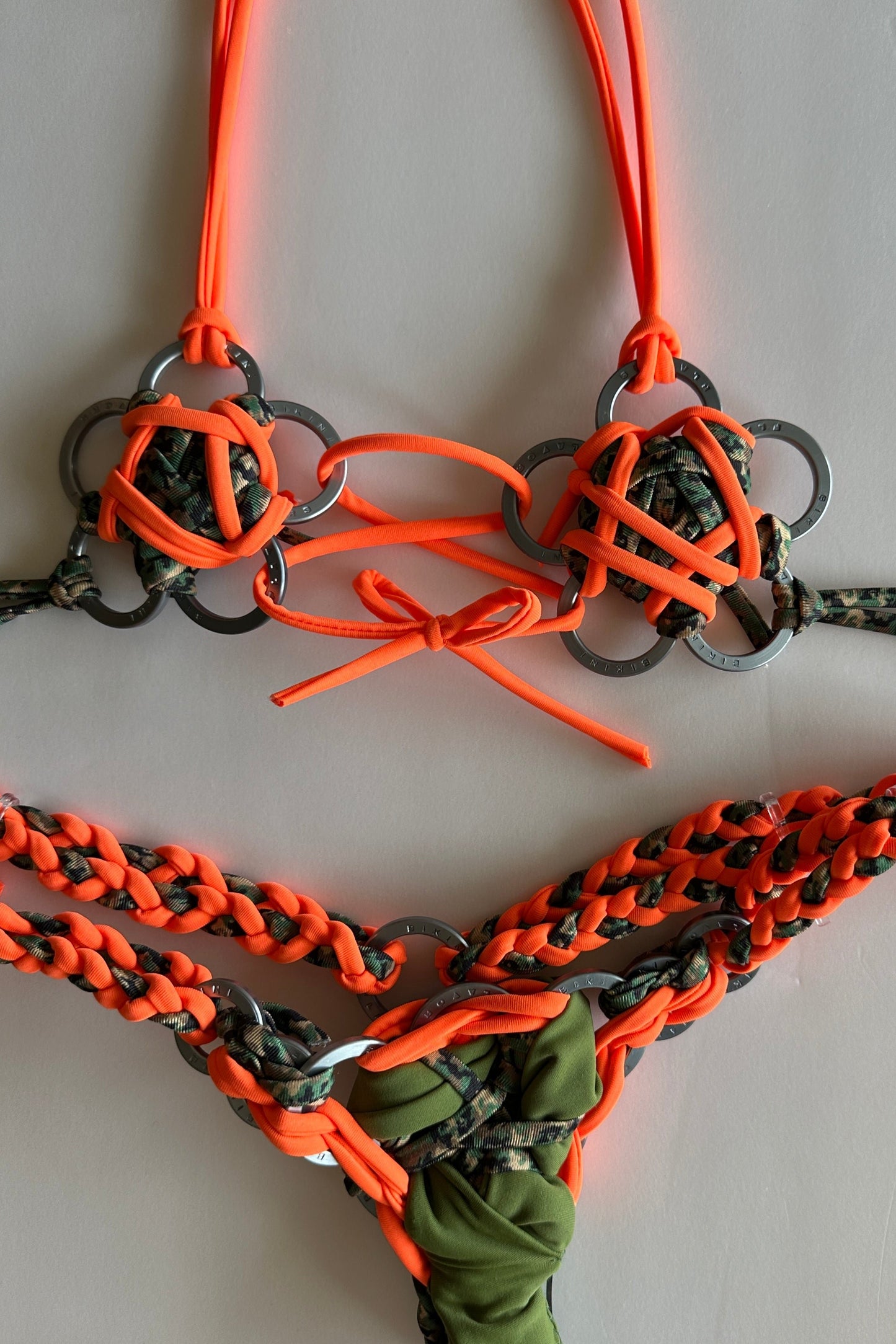 Bikini Flavors hand made micro bikini "The Ellie" shown in camoflauge and orange.  Custom order.