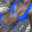 Bikini model wearing BIkini Flavors reversible ruffled triangle top and American bottoms in Berry Breeze.  Thicker straps are used and sold separately.  American made. 